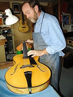 Oskar with a new archtop guitar